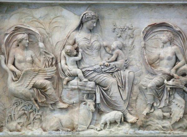 The so-called Tellus panel from the Ara Pacis, ca 9 BCE. Here a goddess, likely the personification of Pax (Peace) or Tellus (the Earth), is surrounded by natural fecundity and symbols of plenty. This panel combined with the other mytho-historical images of the building are an imagery combination of commemorative Roman art. The Ara Pacis has been reassembled in the Museo dell’Ara Pacis in Rome. 